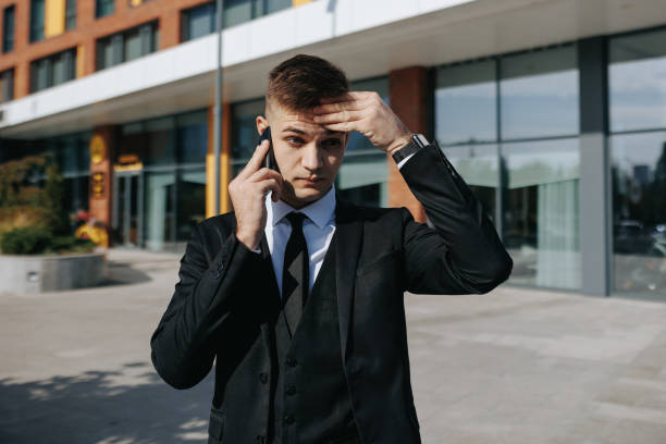 istock Anxious Conversations Troubled Businessman in the Cityscape 2151988616