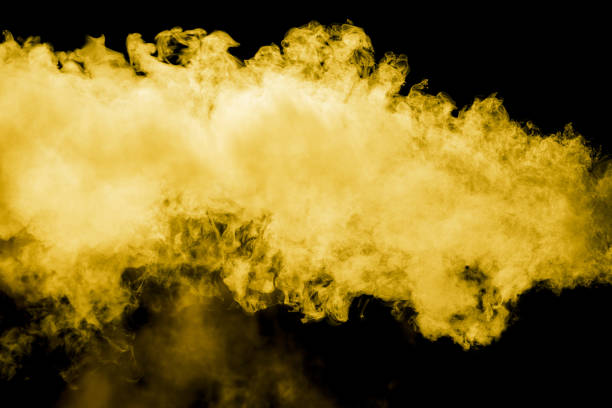istock Yellow smoke isolated black background 2151988667