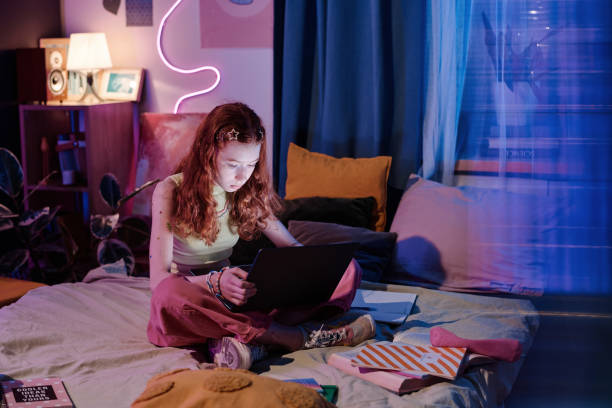 istock Girl Using Laptop Late In Evening 2151989258