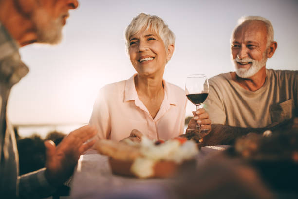istock Happy seniors talking during picnic in nature. 2151992586
