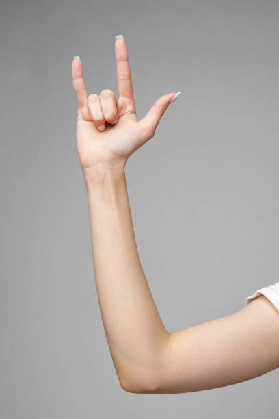 istock Female hand gesturing sign against gray background 2151994368