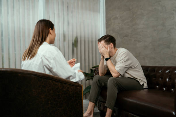 istock Stressed and depressed patient seeking help from psychiatrist. Unveiling 2151995934