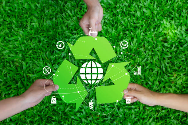 istock Zero waste concept. The picture shows three hands holding a green recycling symbol with a globe in the center with icon. Reuse Reduce Recycle. CSR. Environmental sustainability. volunteer, Unity. ESG. 2151996522