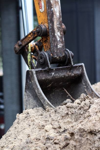 istock Excavator working on the sand at a construction site 2151997091