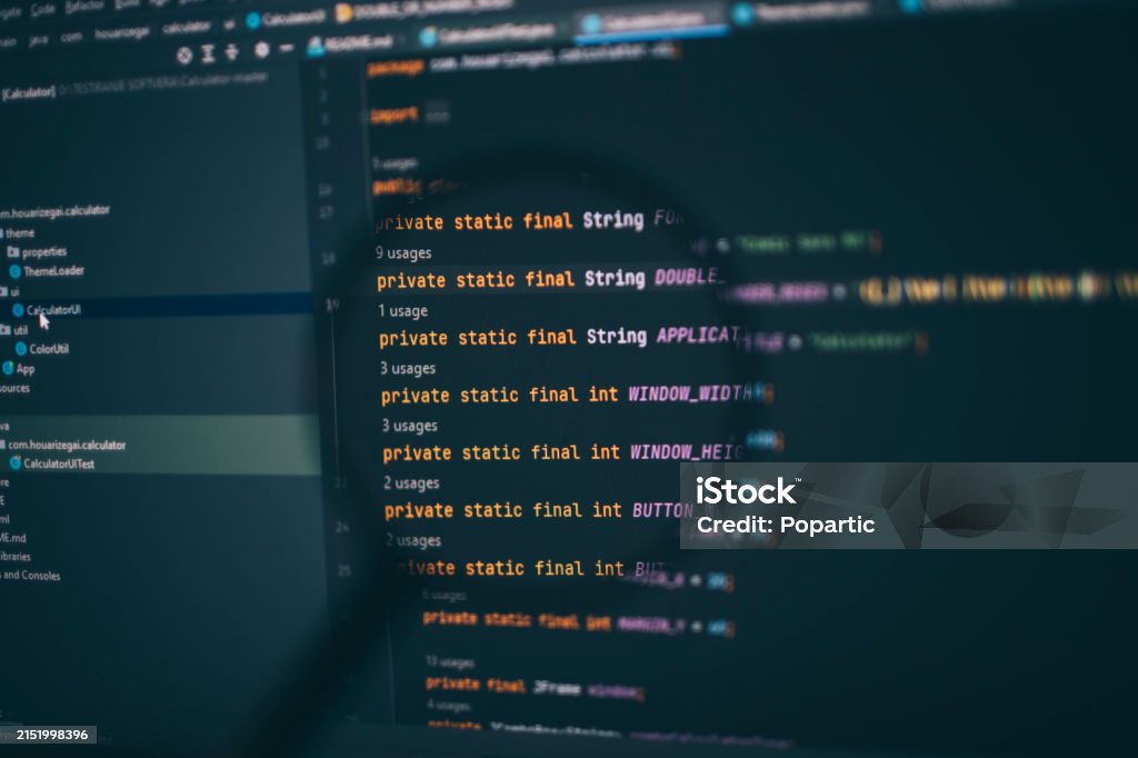 Program Code On Computer Display Under Magnifying Glass Stock Photo ...