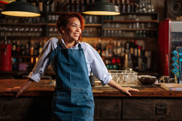 istock Attractive young waitress joyfully looking to the side. 2152001440