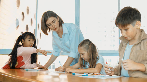 istock Happy student and smart teacher drawing and coloring by using marker. Erudition. 2152001578