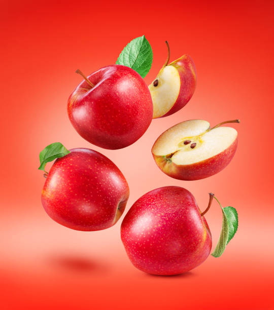 istock Ripe red apples and apple slice isolated on red background. File contains clipping paths. 2152002734