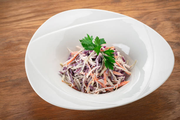 istock Red cabbage and carrot salad in a white plate, vegan healthy dish 2152003221