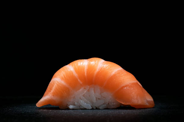 istock Classic sushi nigiri with salmon on a dark stone background, close up, copy space 2152003746