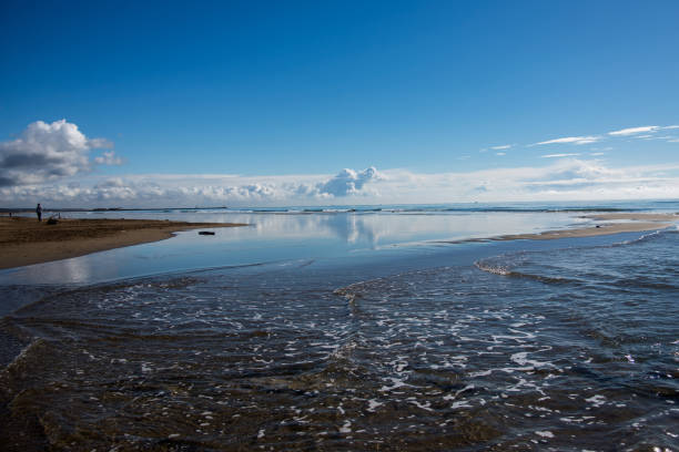 view of waves in border the sea on beautiful cloudy sky background