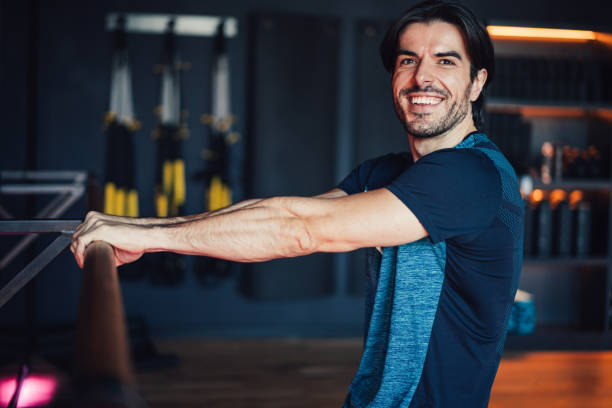 istock Confident young male athlete working out in a gym. 2152006865