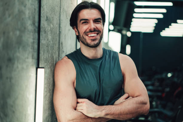 istock Confident young male athlete working out in a gym. 2152006881