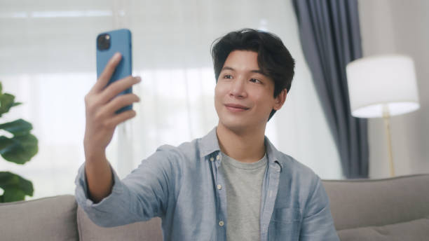 istock Asian Man Captures a Selfie with a Content Smile. 2152007101