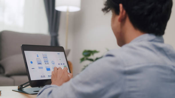 istock Professional Reviewing UI Designs on Digital Tablet. 2152007116