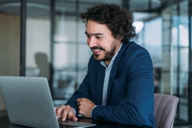 istock Successful businessman in modern office working on laptop. 2152007211