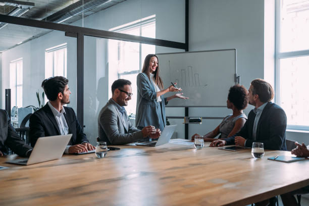 istock Businesswoman giving presentation with colleagues. 2152007782