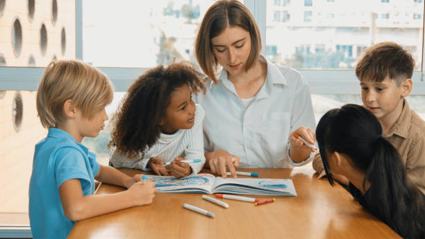 istock Happy student and smart teacher drawing and coloring by using marker. Erudition. 2152010582