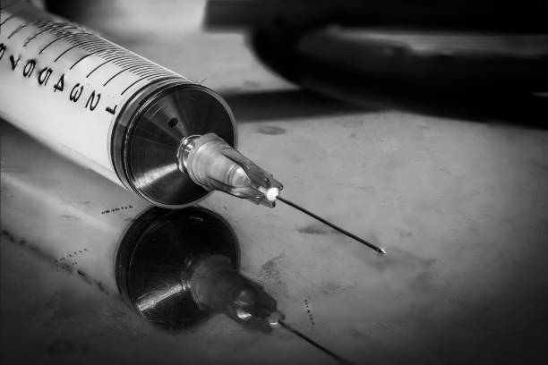 istock close up the syringe on the tray with dramatic tone 2152010779