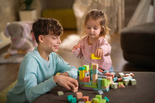 istock Children playing whit toy blocks at home 2152012440