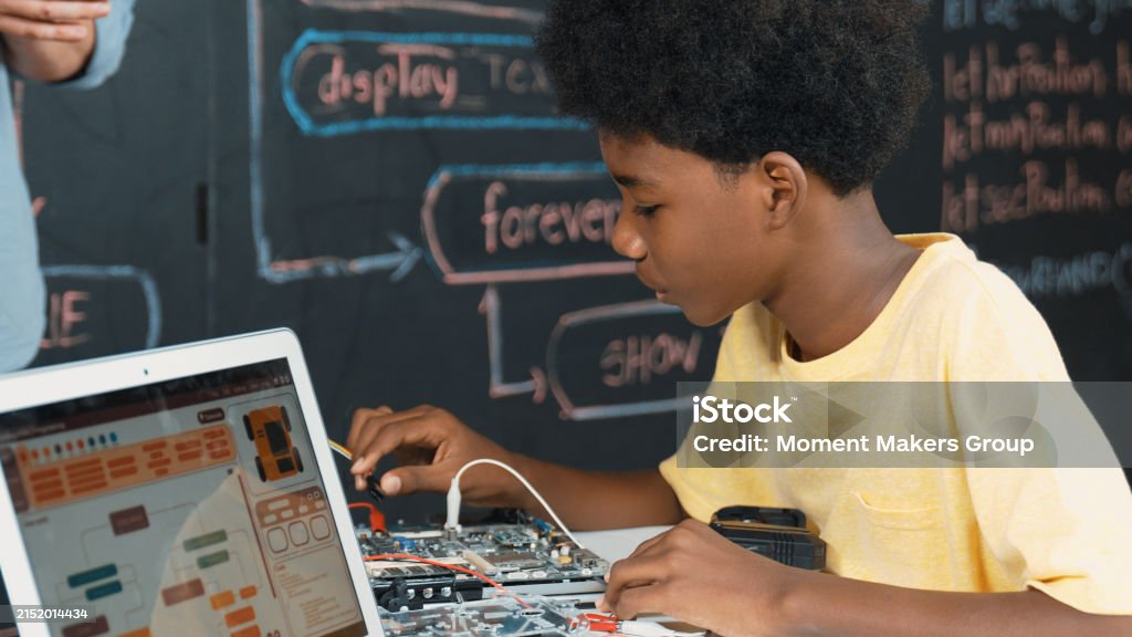 Boy Learning Tech Cute Boy Learning To Use Electronic Tool While Laptop Display Code ...