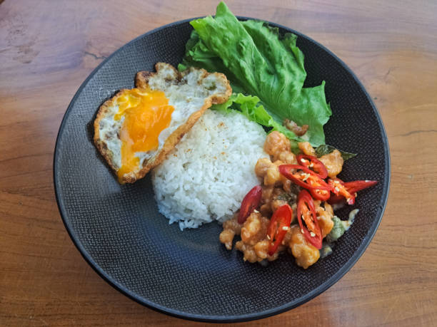 istock Delicious Buttermilk Fried Chicken With Rice, Sunny Side Up, Chopped Chilli, Salt And Lettuce. Food Menu. 2152016270