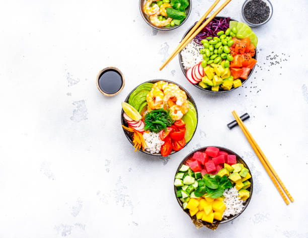 istock Poke bowls with vegetables and seafood in assortment, white table background, top view 2152018272
