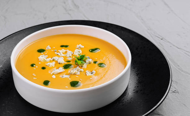 istock Creamy pumpkin soup in elegant white bowl 2152021632