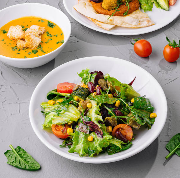 istock Fresh vegetarian salad and soup meal setup 2152022172