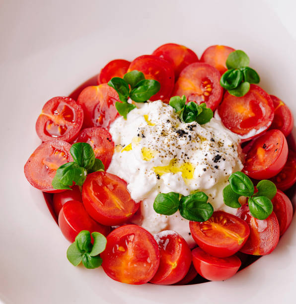 istock Fresh tomato and basil salad with burrata cheese 2152022517