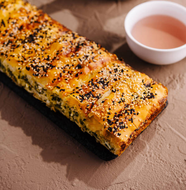 istock Artisanal sesame seed bread loaf with tea 2152023404