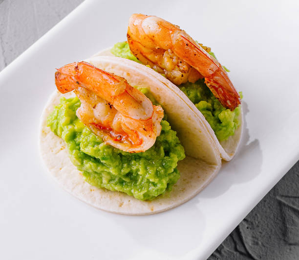 istock Gourmet shrimp appetizer with avocado puree in pita on elegant plate 2152023817