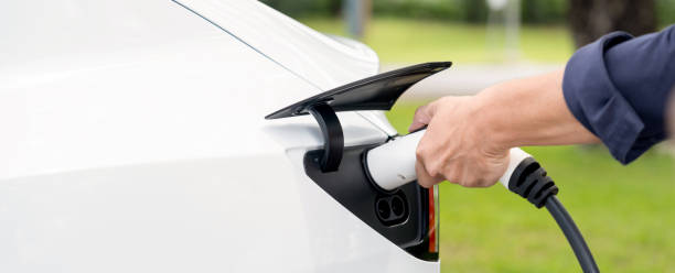 istock Man recharge EV electric vehicle battery from EV charging station. Exalt 2152029134