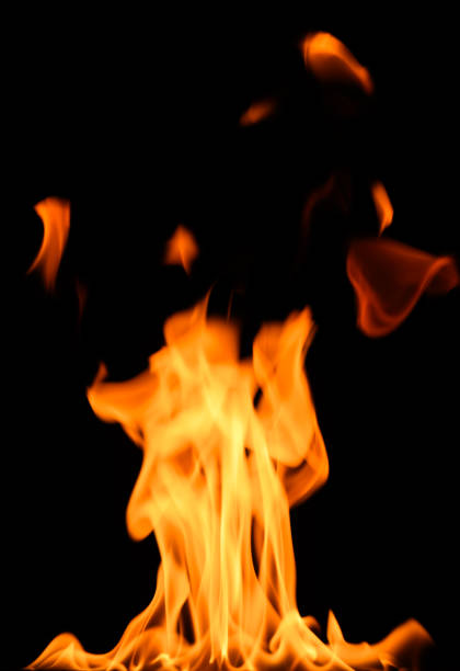 fire on a black background, burning and hot flames, close view