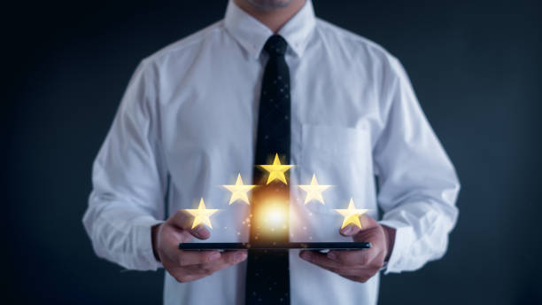 istock Customer service experience and business satisfaction survey, close up  hand using smart phone and give five star symbol to increase rating of product and service concept. 2152034058