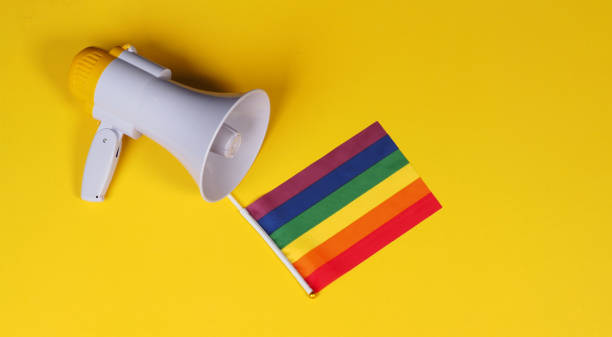 istock megaphone and rainbow flag on yellow background. 2152034660