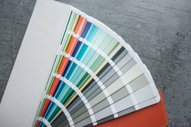 istock Rainbow catalog of paints with a various color palette on grey desk 2152035592