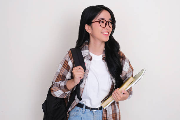 istock Female college student looking away with happy expression 2152037417