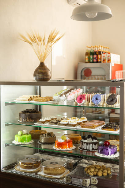 istock Sweet Selection: Muffins, Eclairs, Donuts, and More on Display in Coffee Shop Showcase 2152037833