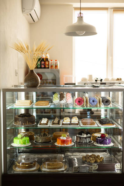 istock Sweet Selection: Muffins, Eclairs, Donuts, and More on Display in Coffee Shop Showcase 2152037913