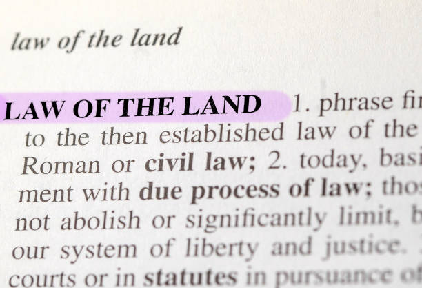 close up photo of the words law of the land