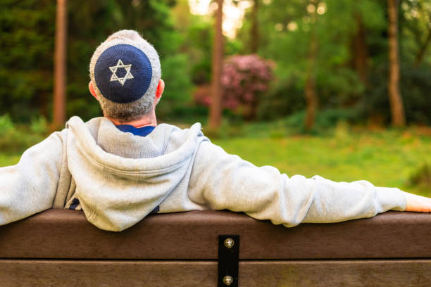 istock Jewish man wearing kippah in park 2152040617