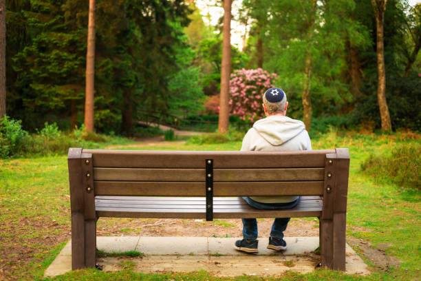 istock Jewish man wearing kippah in park 2152040618