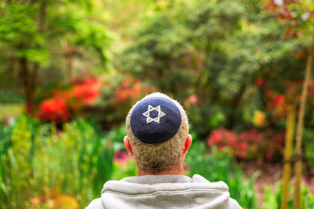 istock Jewish man wearing kippah in park 2152040778