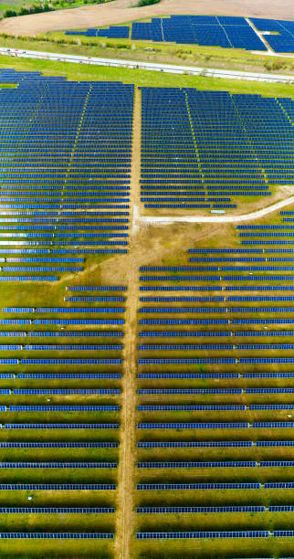 istock Aerial view of field with solar panels 2152040796