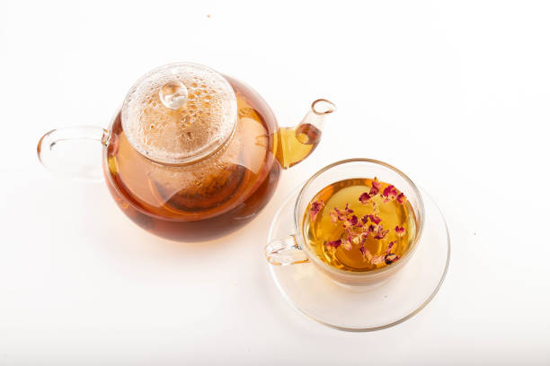 istock Tea made from tea rose petals in a glass bowl on white background. 2152040859