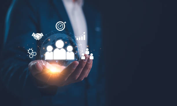 istock Employing CRM, the businessman manages global customer networks, leveraging technology for data exchanges and development, context of customer service, banking, and strategic business initiatives. 2152043981