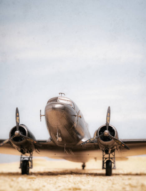 A scale model of the iconic bare-metal DC-3 Dakota in the desert.