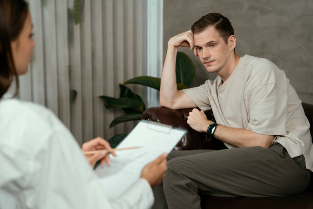 istock Stressed and depressed patient seeking help from psychiatrist. Unveiling 2152051050