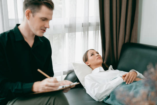 istock Stressed and depressed patient seeking help from psychiatrist. Unveiling 2152051407